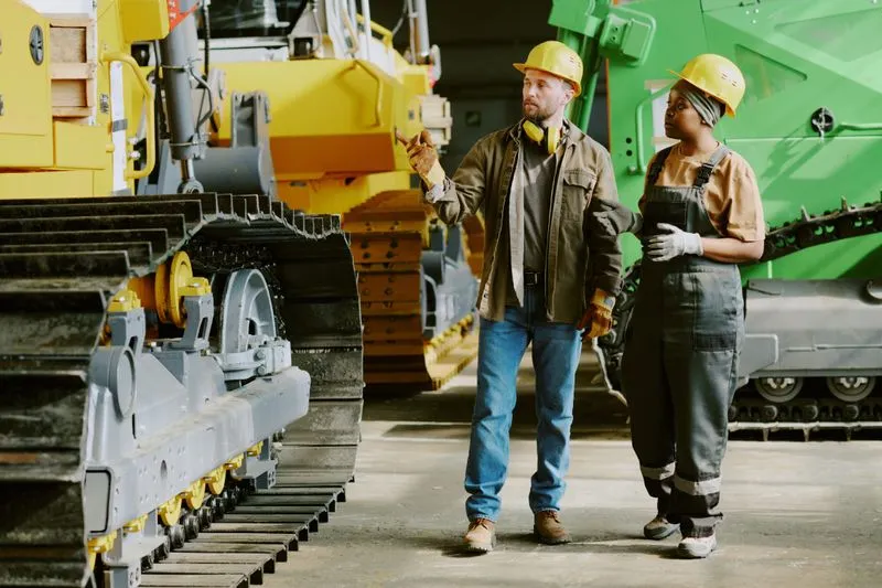 Construction workers with industrial equipment